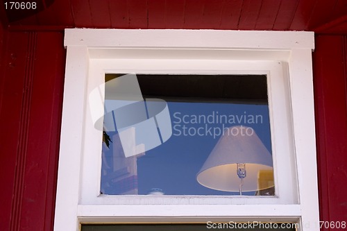 Image of Close up on a Window with Lamp inside