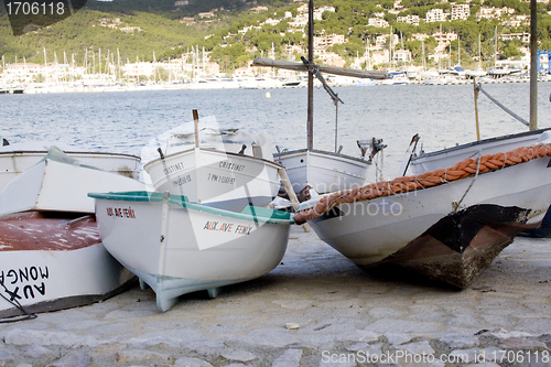 Image of Row Boats Lined Up In Marina