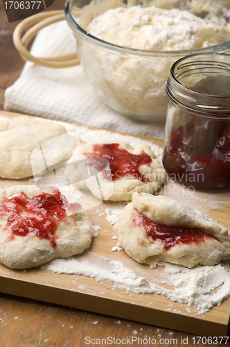 Image of Dough with marmelade on wooden board