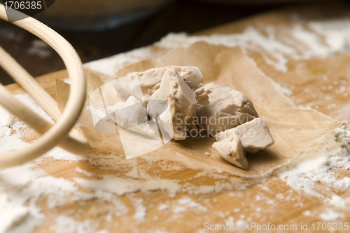 Image of Baker's yeast on wooden board