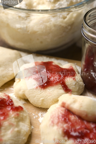 Image of Dough with marmelade on wooden board