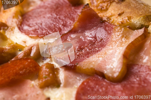 Image of Italian pizza with bacon, salami and mozzarella cheese