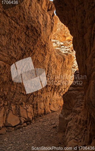 Image of Narrow slot between two rocks in desert canyon