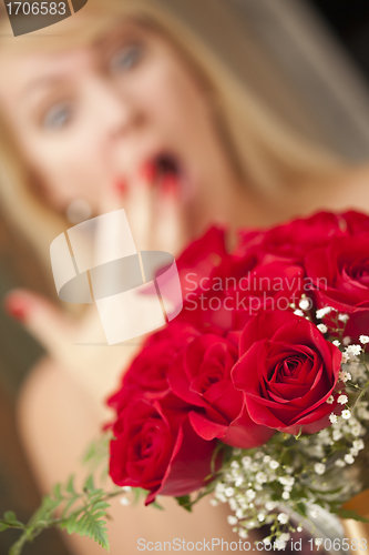 Image of Blonde Woman Accepts Gift of Red Roses