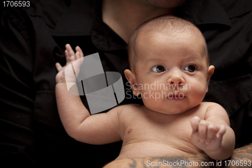 Image of Young Father Holding His Mixed Race Newborn Baby