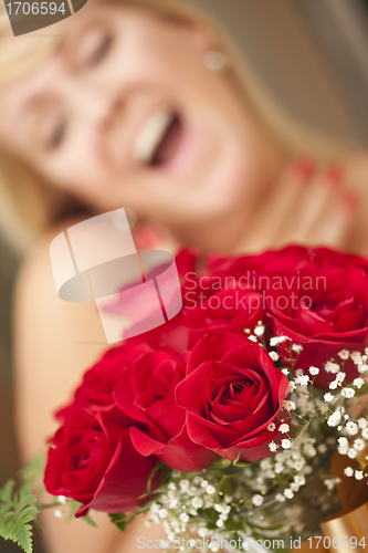 Image of Blonde Woman Accepts Gift of Red Roses