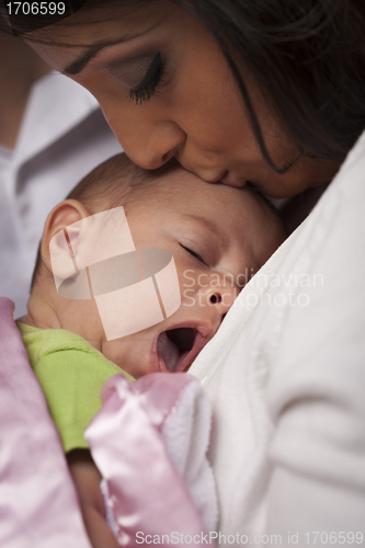 Image of Attractive Ethnic Woman with Her Yawning Newborn Baby