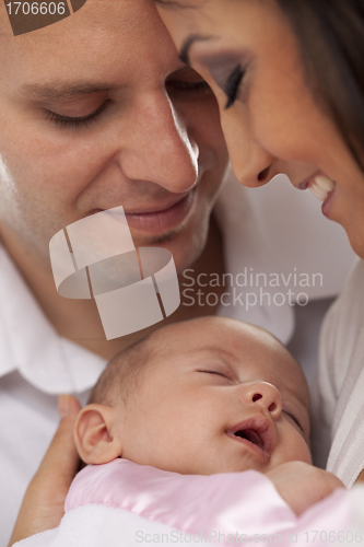 Image of Mixed Race Young Couple with Newborn Baby