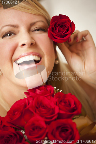 Image of Woman with a Bunch of Red Roses.