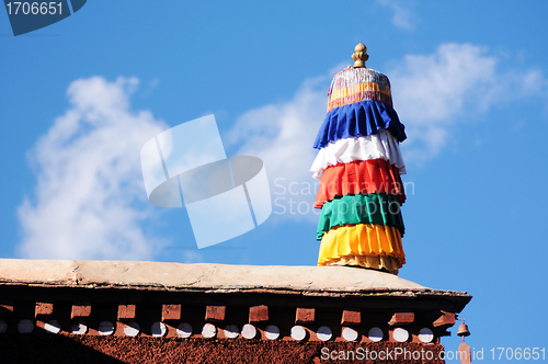 Image of Colorful prayer flags on the roof