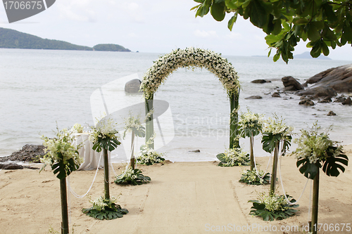 Image of Beautiful beach wedding set-up.