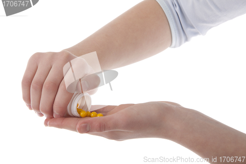 Image of Hands holding vitamins