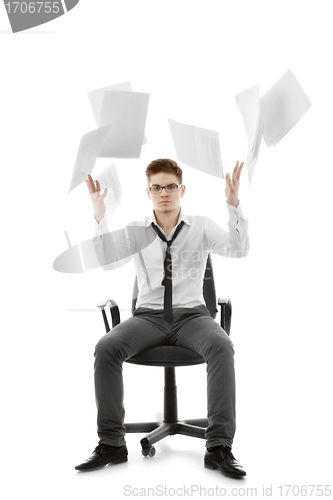 Image of Young man throwing paper