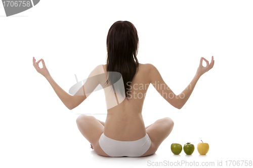 Image of Girl practicing yoga on white