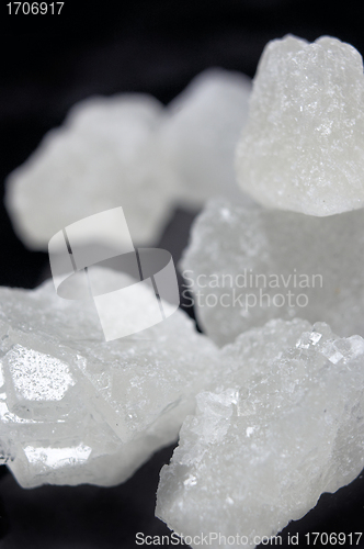 Image of pieces of rock sugar crystal over black