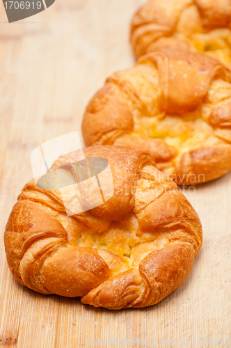 Image of fresh baked french croissant brioche on wood board