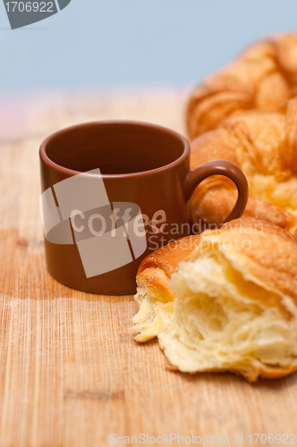 Image of fresh baked french croissant brioche on wood board