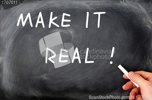 Image of Make it real with a hand holding chalk