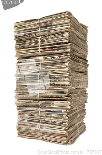 Image of Towering stack of newspapers for recycling