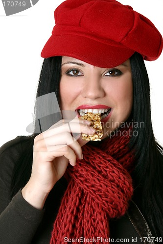 Image of Female eating healthy nut bar