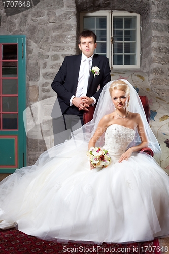 Image of beautiful groom and bride in interior