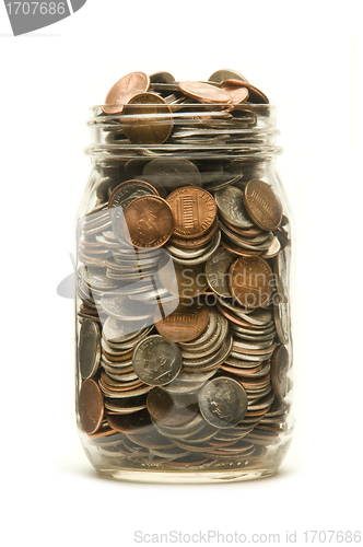 Image of Glass jar overflowing with American coins