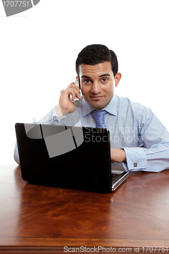 Image of Businessman taking a phone call