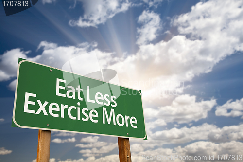 Image of Eat Less Exercise More Green Road Sign and Clouds