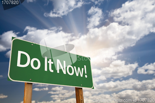 Image of Do It Now! Green Road Sign and Clouds