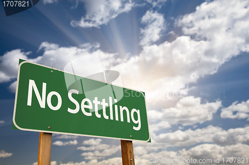 Image of No Settling Green Road Sign and Clouds