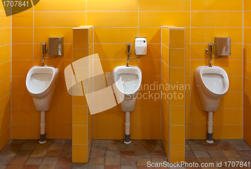 Image of Three urinal in the bathroom