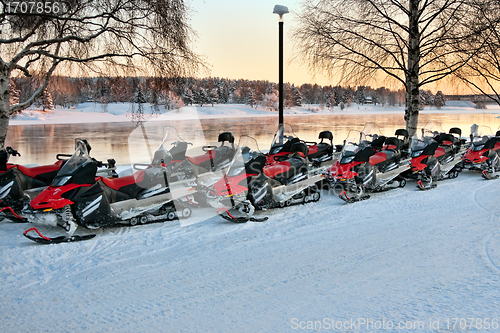 Image of Vehicles are a number of snowmobiles