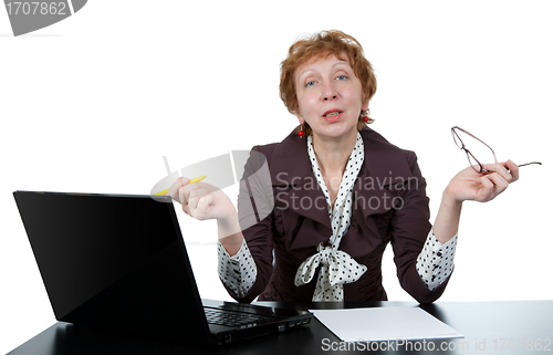 Image of middle-aged woman at a computer