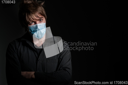 Image of Young man with protective mask