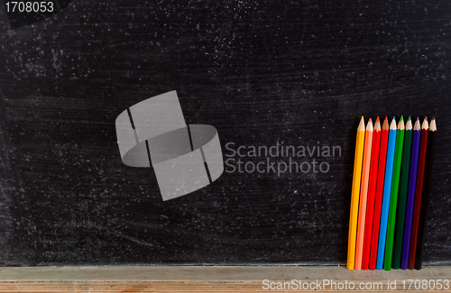 Image of Colorful pencils and board
