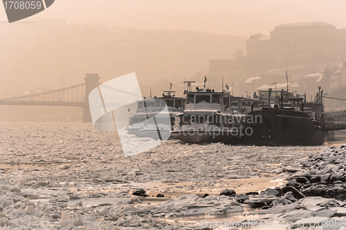 Image of Frozen boats on the river