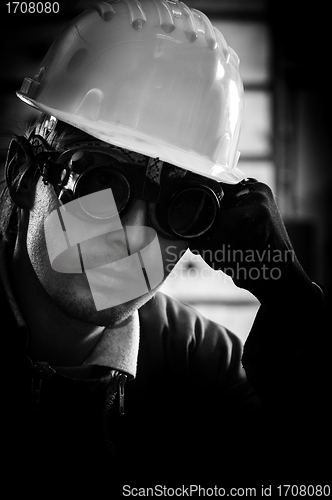 Image of Hard working man in helmet