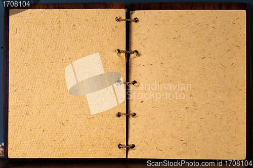 Image of Opened book agains dark board