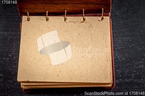 Image of Empty notebook on black background