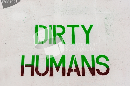 Image of Dirty humans written on white wall