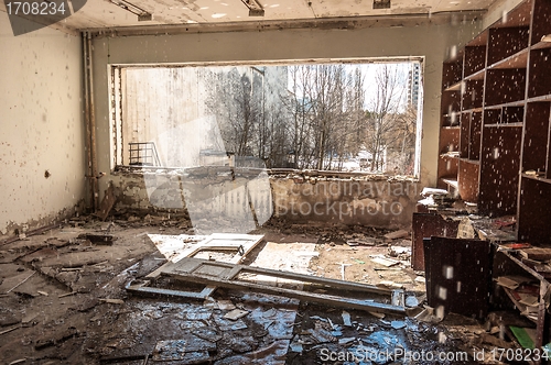 Image of Water pouring down on wall in abandoned room in pripyat