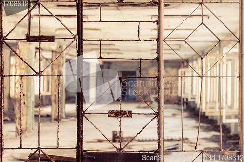 Image of Vintage broken window with blurry corridor