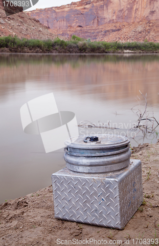 Image of portable toilet on a shore of southwestern river