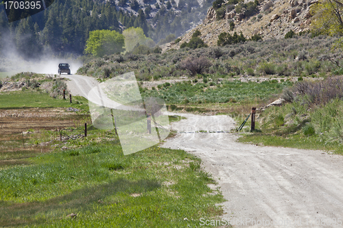 Image of dusty road in a mountain canyon