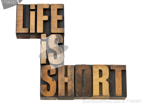 Image of life is short phrase in wood type
