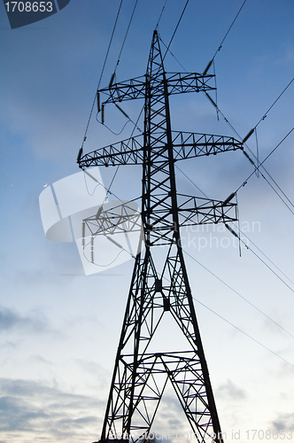 Image of Silhouette of a pillar of electricity transmissions on a backgro