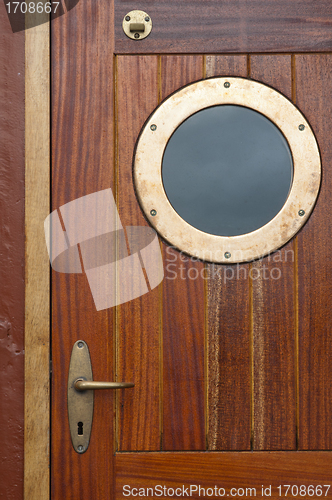 Image of Old ship door with a window