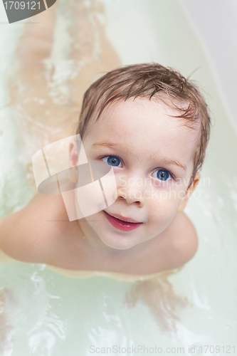 Image of Baby taking bath and swim on chest