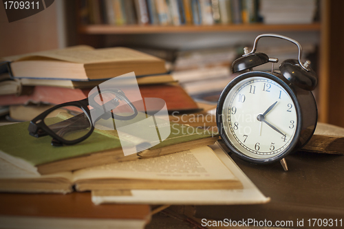 Image of books with clock