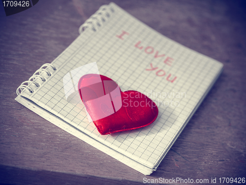 Image of red heart on the notebook